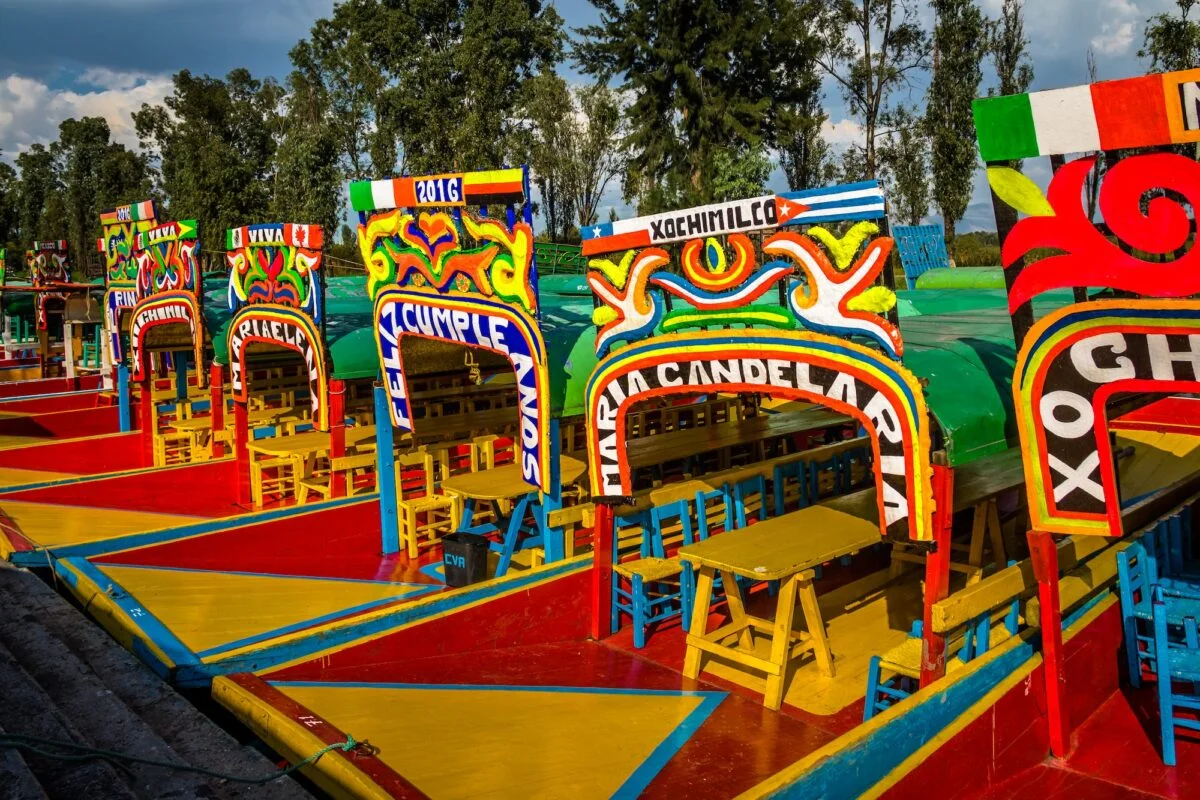 Colourful Mexican boats with women names at Xochimilco's Floating Gardens - Mexico City, Mexico