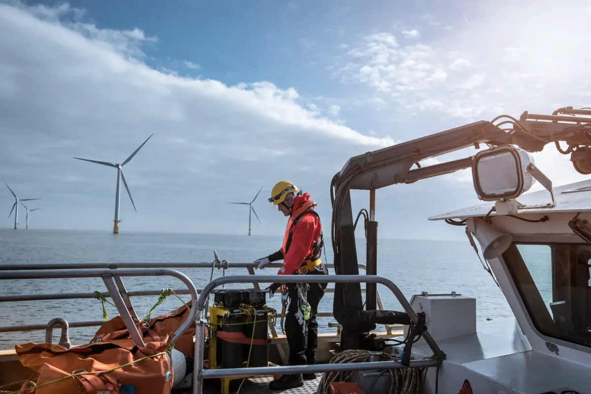 Engineer on deck of service boat at offshore windfarm