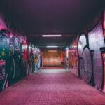 empty tunnel pathway with graffiti walls