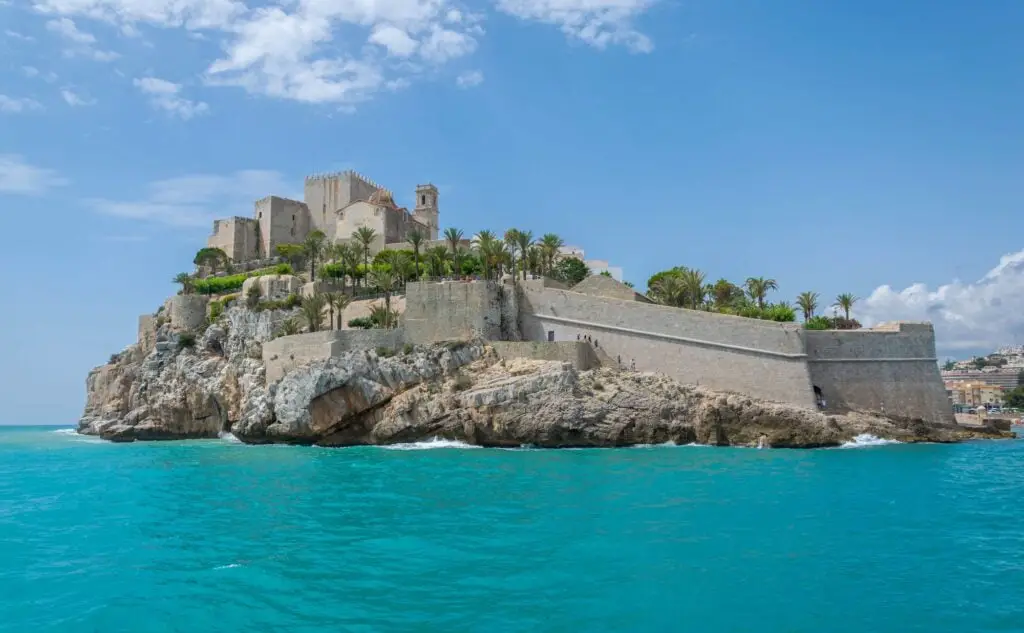 Peniscola Castle overlooking the Mediterranean Sea on blue white sky background in Spain